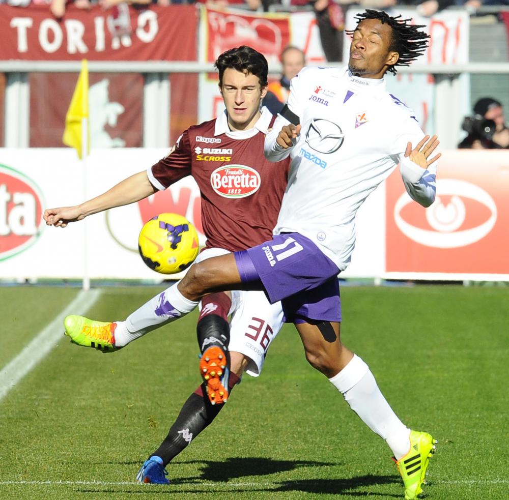 Mg Torino 12/01/2013 - campionato di calcio serie A / Torino-Fiorentina
nella foto: Matteo Darmian-Juan Cuadrado