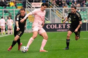 Palermo, Italy, 14 February 2026. Renzo Barbera Stadium, Palermo vs Virtus Entella, match valid for the 2025/2026 Serie B championship. In the photo: Filippo Ranocchia (Palermo FC) and Mattia Tirelli (Virtus Entella) and Luigi Cuppone (Virtus Entella)