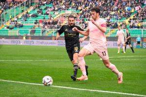 Palermo, Italy, 14 February 2026. Renzo Barbera Stadium, Palermo vs Virtus Entella, match valid for the 2025/2026 Serie B championship. In the photo: Luigi Cuppone (Virtus Entella) and Mattia Bani (Palermo FC)